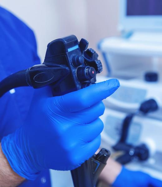 Gastroscopy, endoscopy. Gastroscopy, endoscopy. Hands of the Doctor at the ready for the operation Apparatus for cavity research: fibrogastroduodenoscopy, the study of the stomach